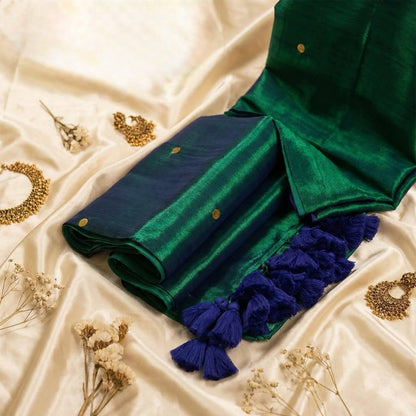 Green and blue fabric with tassels on a beige background
